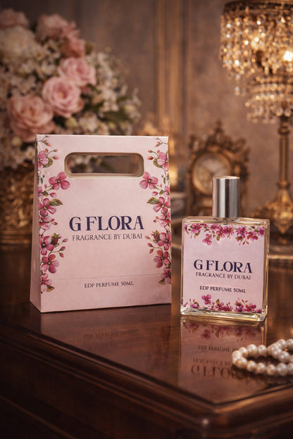 G'Flora perfume bottle and packaging on a reflective surface with decorative background