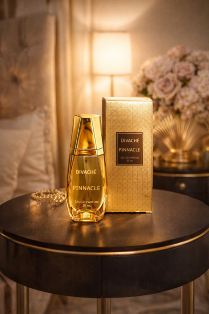Divache Pinnacle perfume bottle and packaging on a table with soft lighting